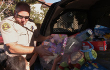 Deputy Tom Drake Gives Gifts to Neighborhood Children